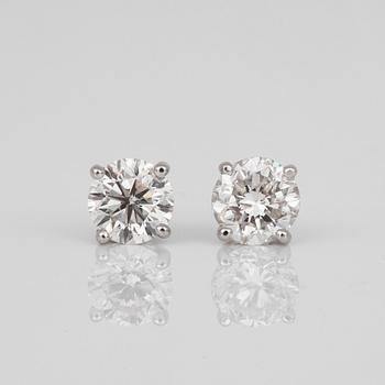 A pair of brilliant-cut diamond earrings. Center diamonds circa 0.70 cts/each.