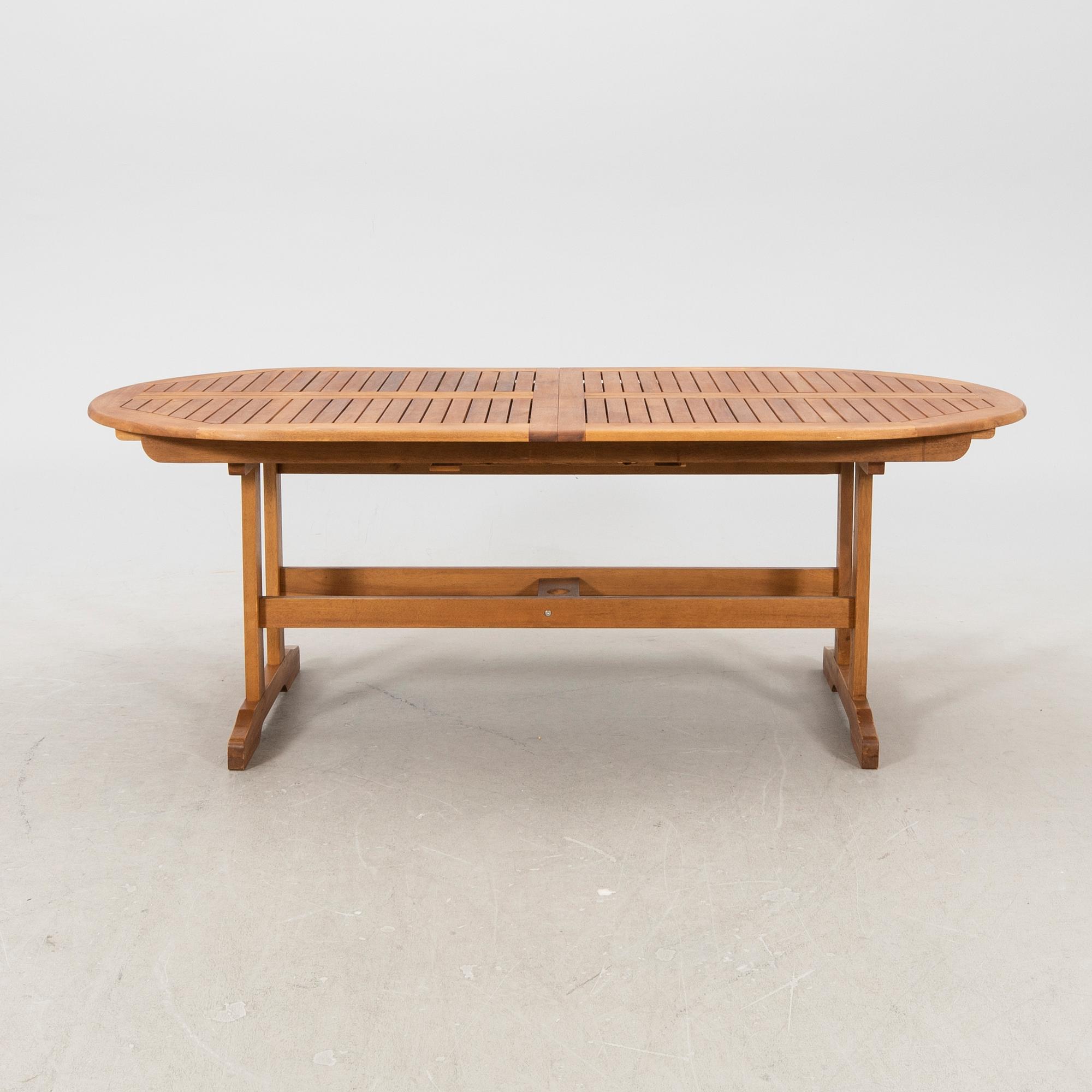 A 9 pcs stained teak garden suite by Brafab around 2000.