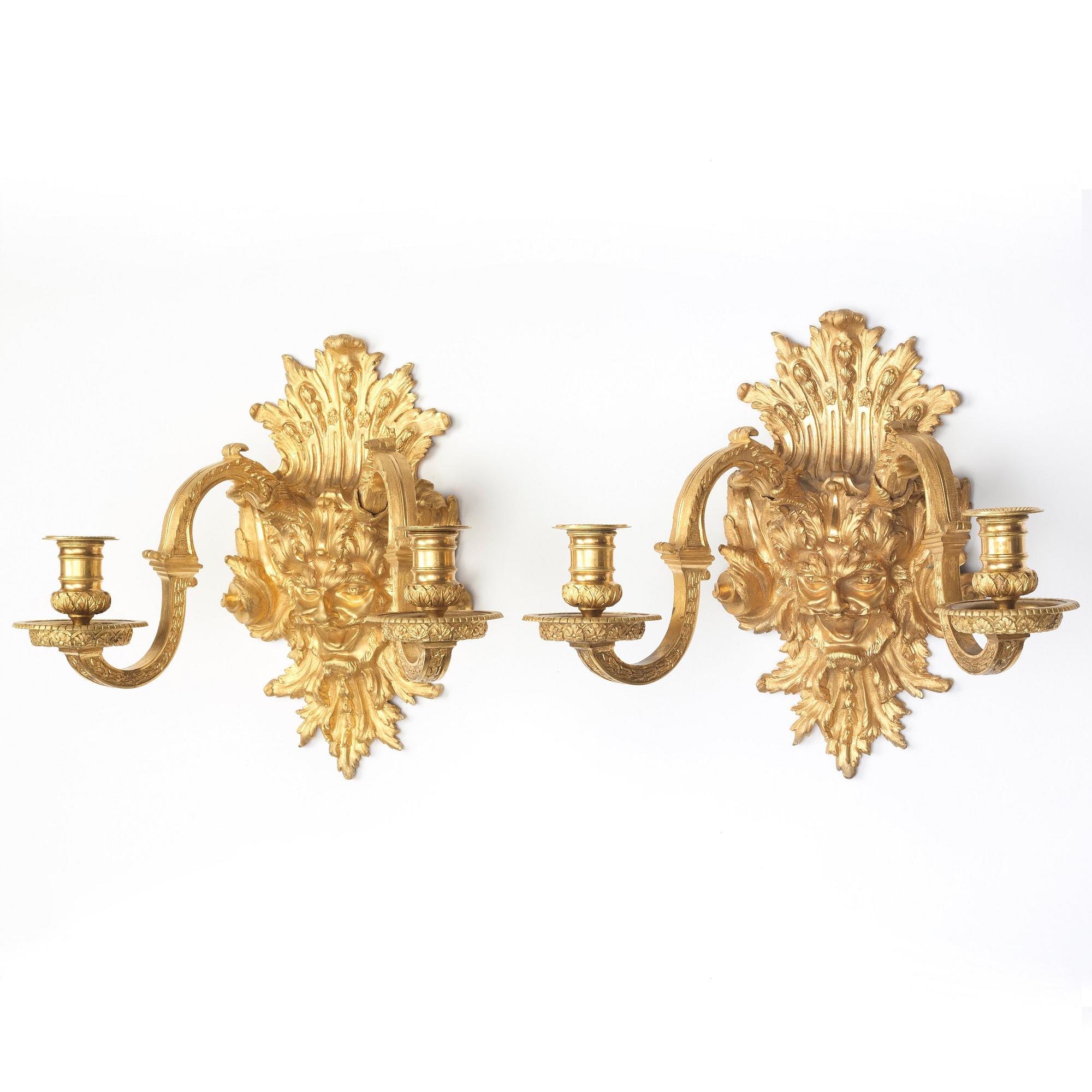 A pair of Baroque-style mid 19th century two-light wall-lights.