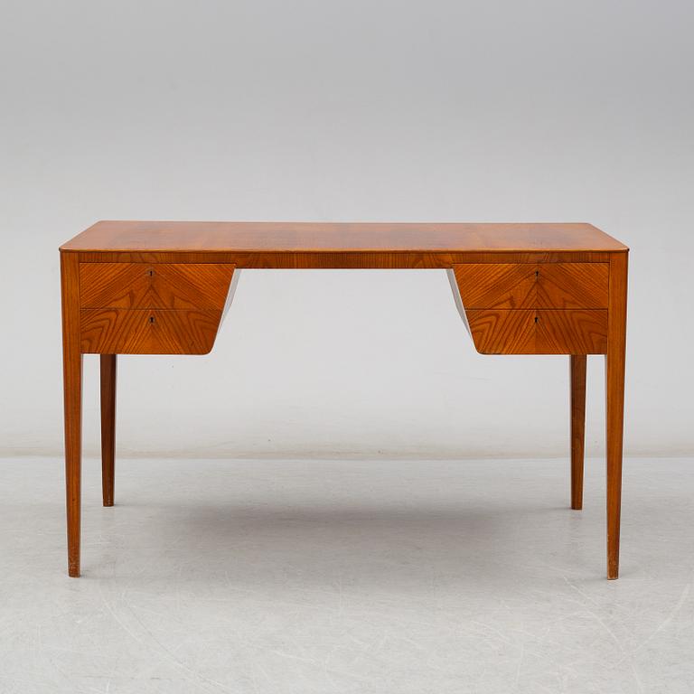 A mid 20th century elm veneered desk.