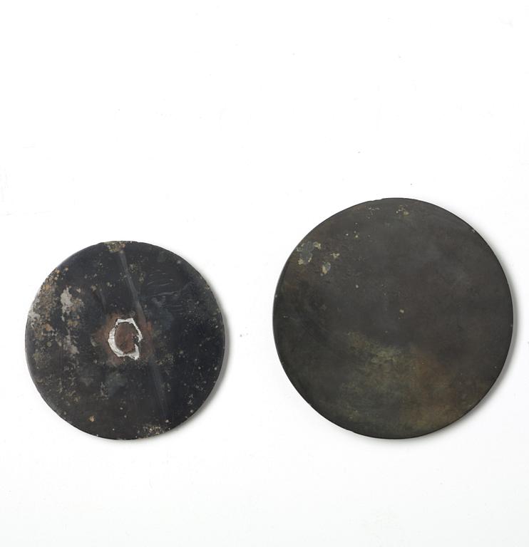 Two bronze mirrors, Han dynasty (206 B.C. - 220 A.D.).