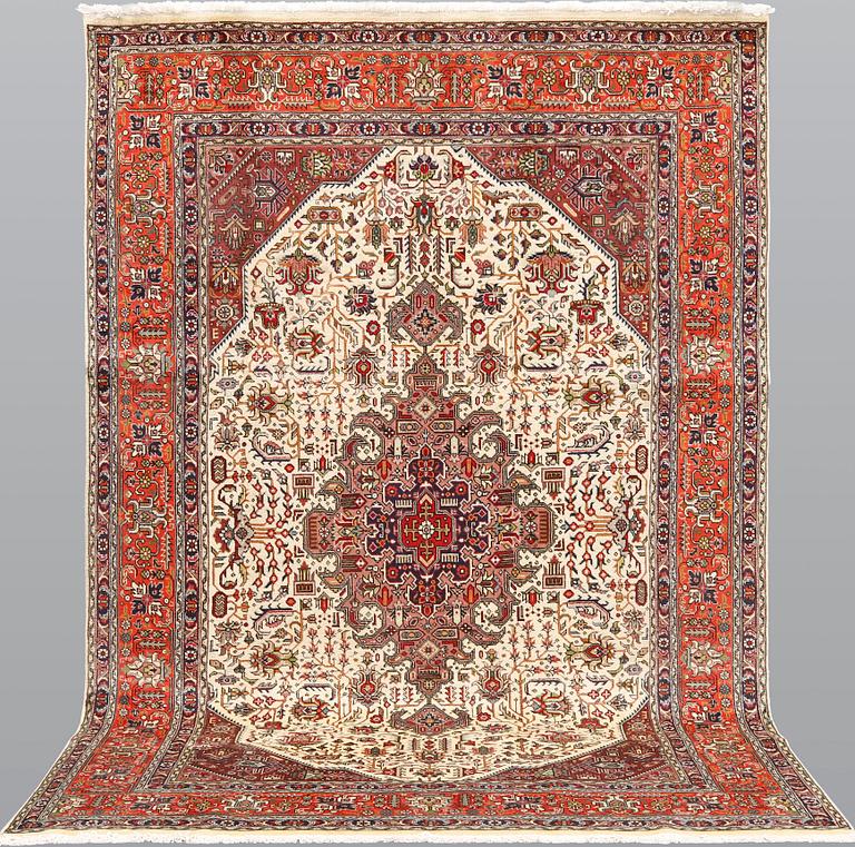 A Tabriz carpet, approximately 298 x 198 cm.