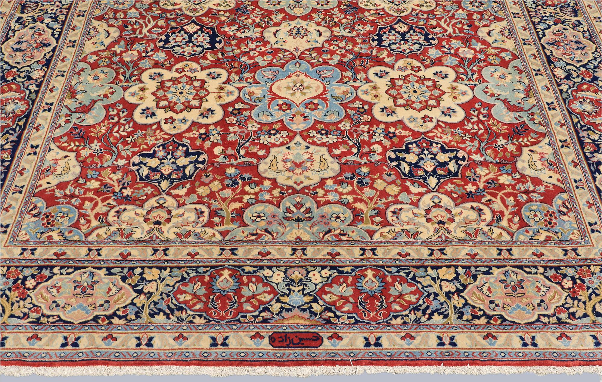 A Sarouk carpet, signed, approx. 327 x 253 cm.