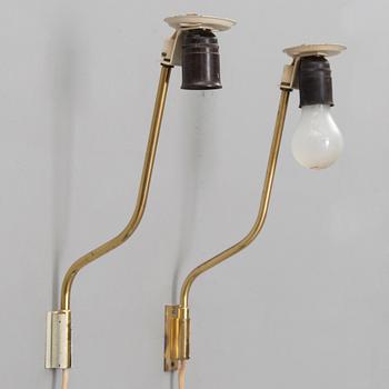 A pair of mid-20th century '3053' wall lights for Stockmann Orno, Finland.