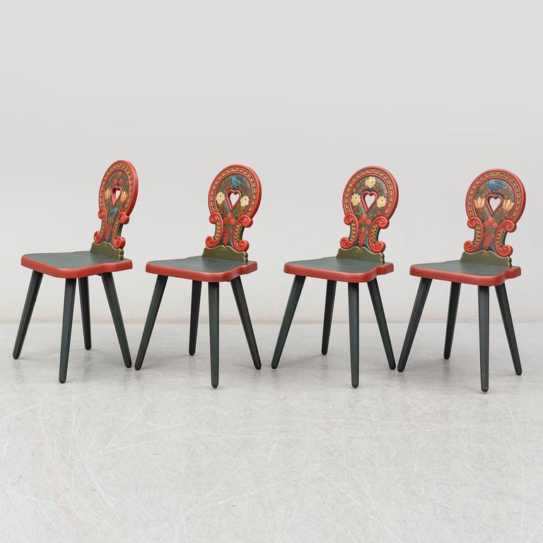 A second half of the 20th Century dining table and four chairs painted by the Hungrarian artist Laszlo Holló.