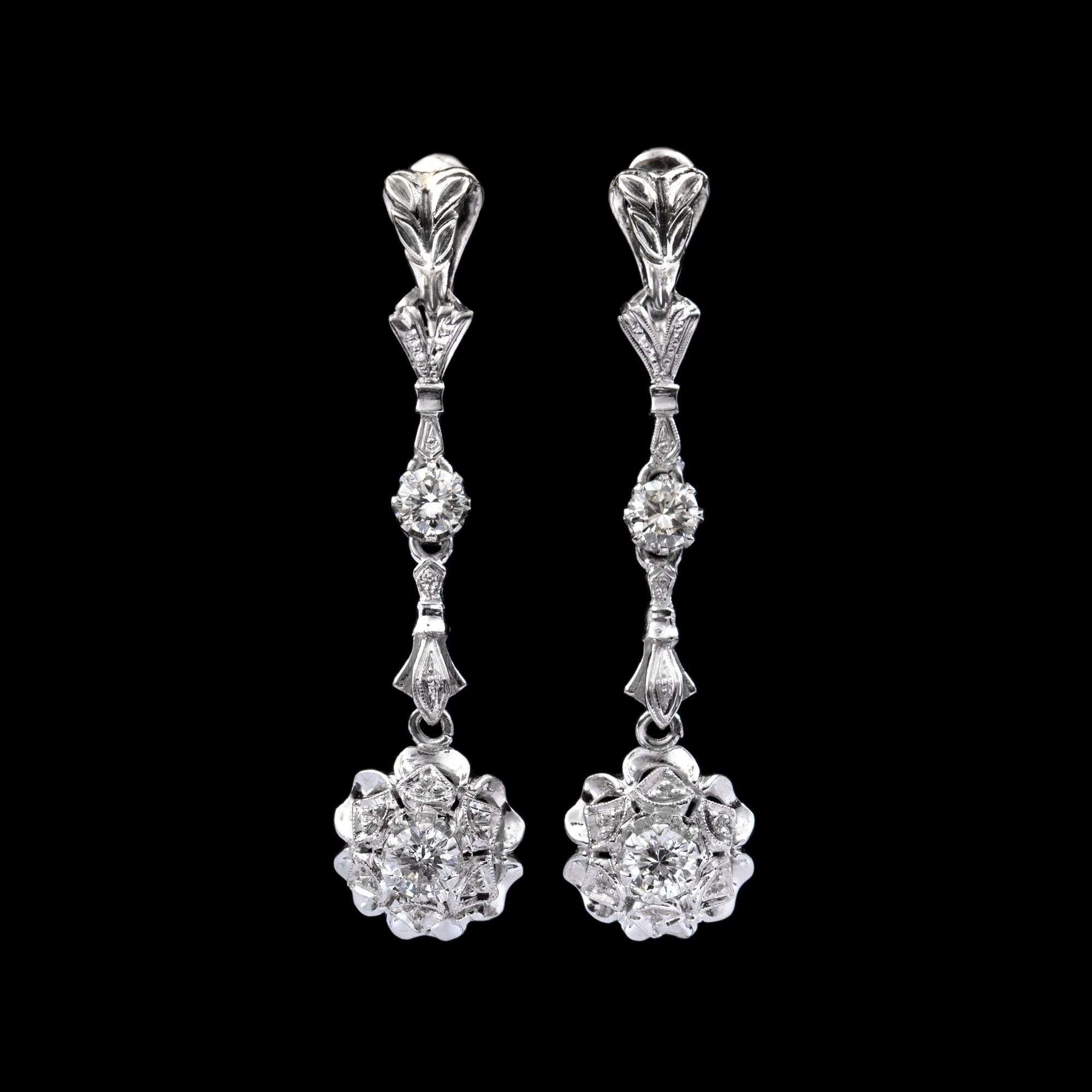 A pair of diamond earrings. Total carat weight circa 0.90 ct.