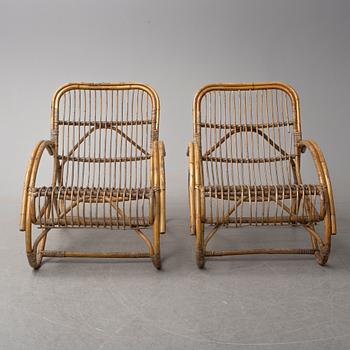 a pair of rattan easy chairs, 20th century.