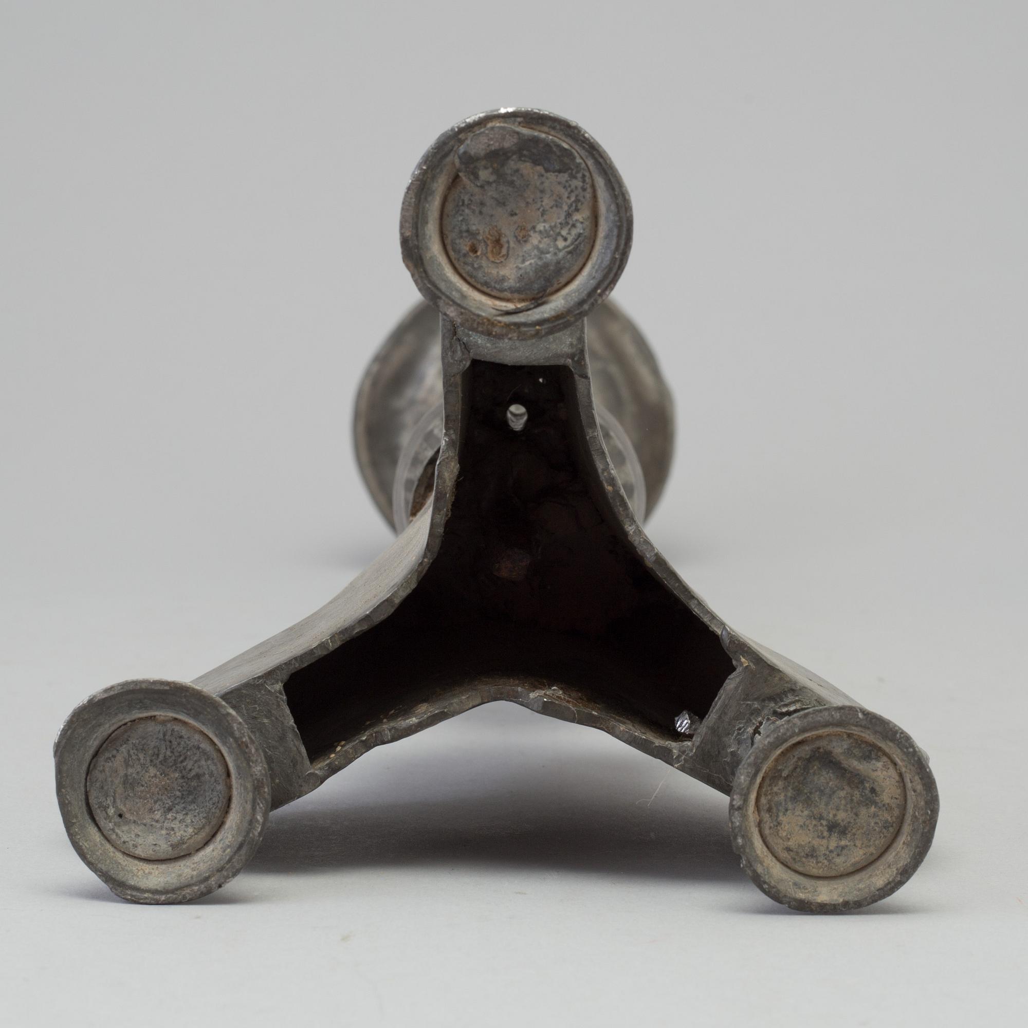 A 17th century pewter candlestick.