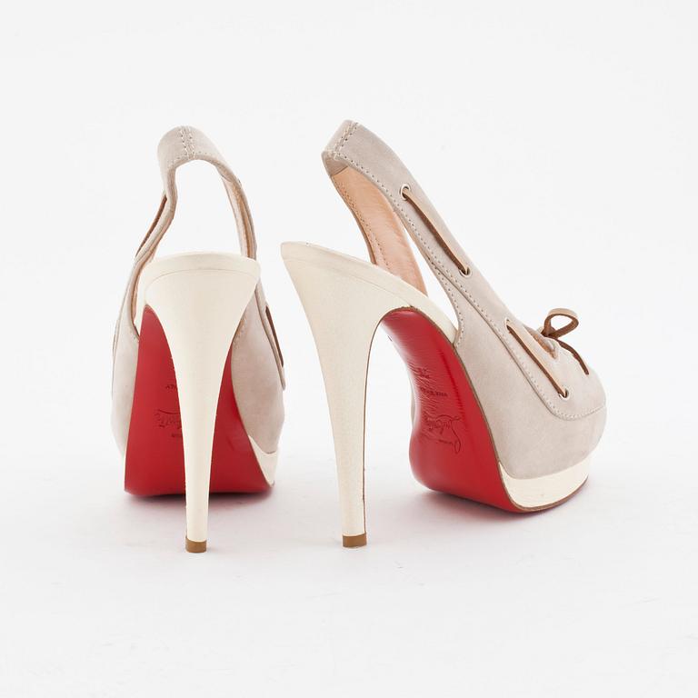 CHRISTIAN LOUBOUTAIN, a pair of grey suede and withe leather slingbacks.