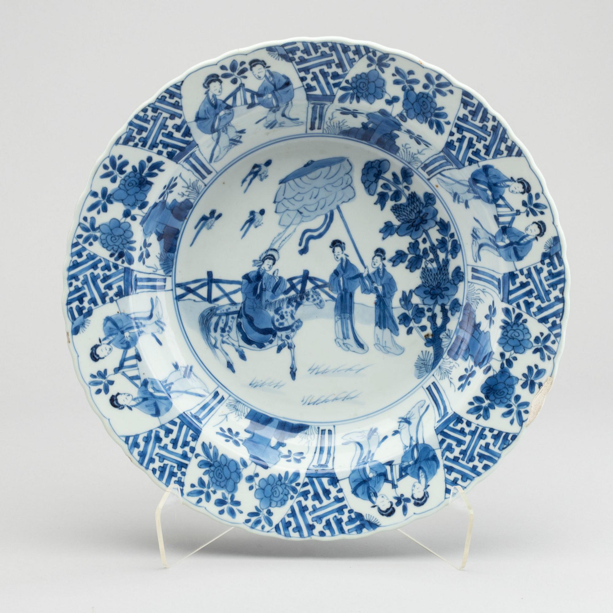 A large blue and white deep dish, Qing dynasty, with Kangxi six character mark and period (1662-1722).