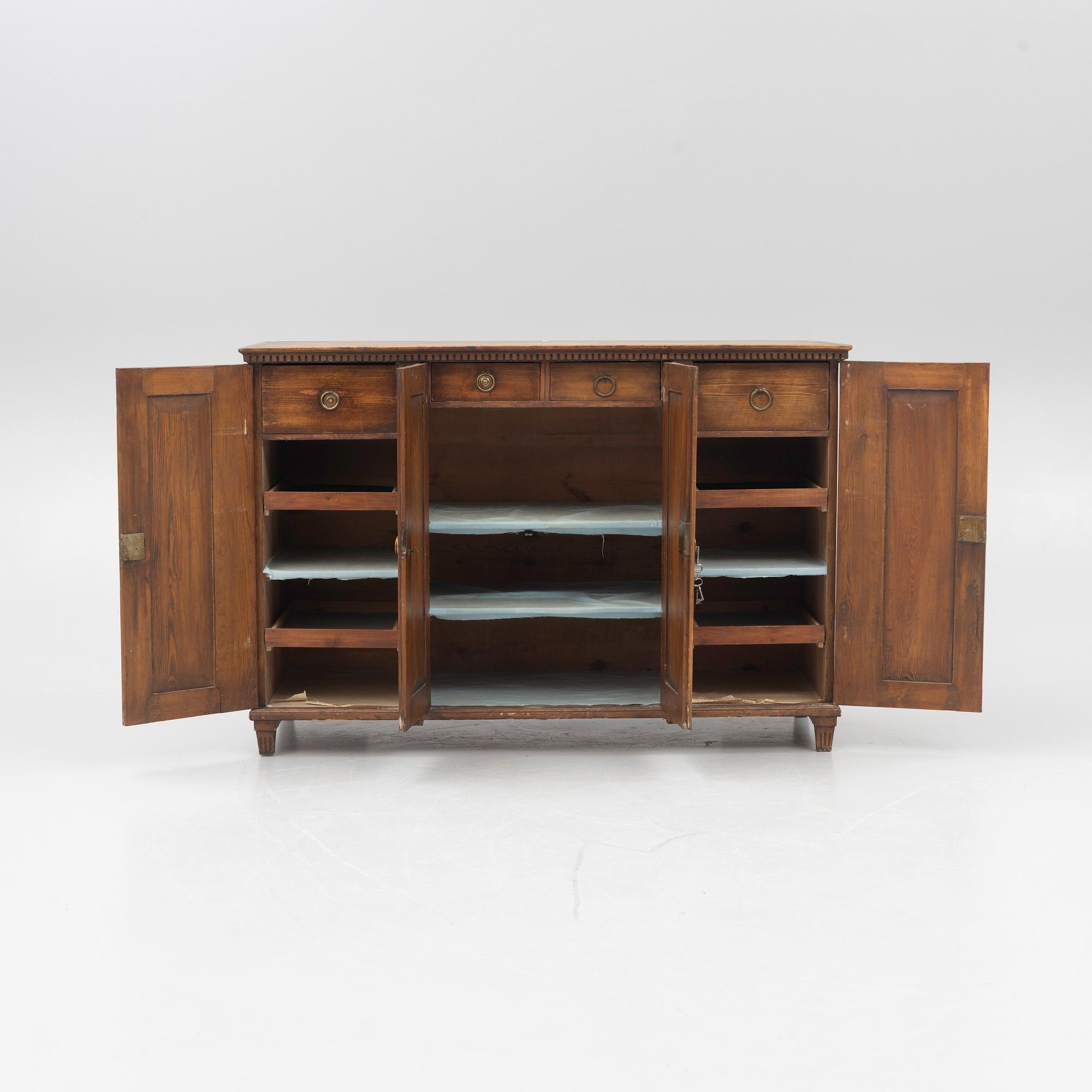 A Gustavian pine cupboard, late 18th century.