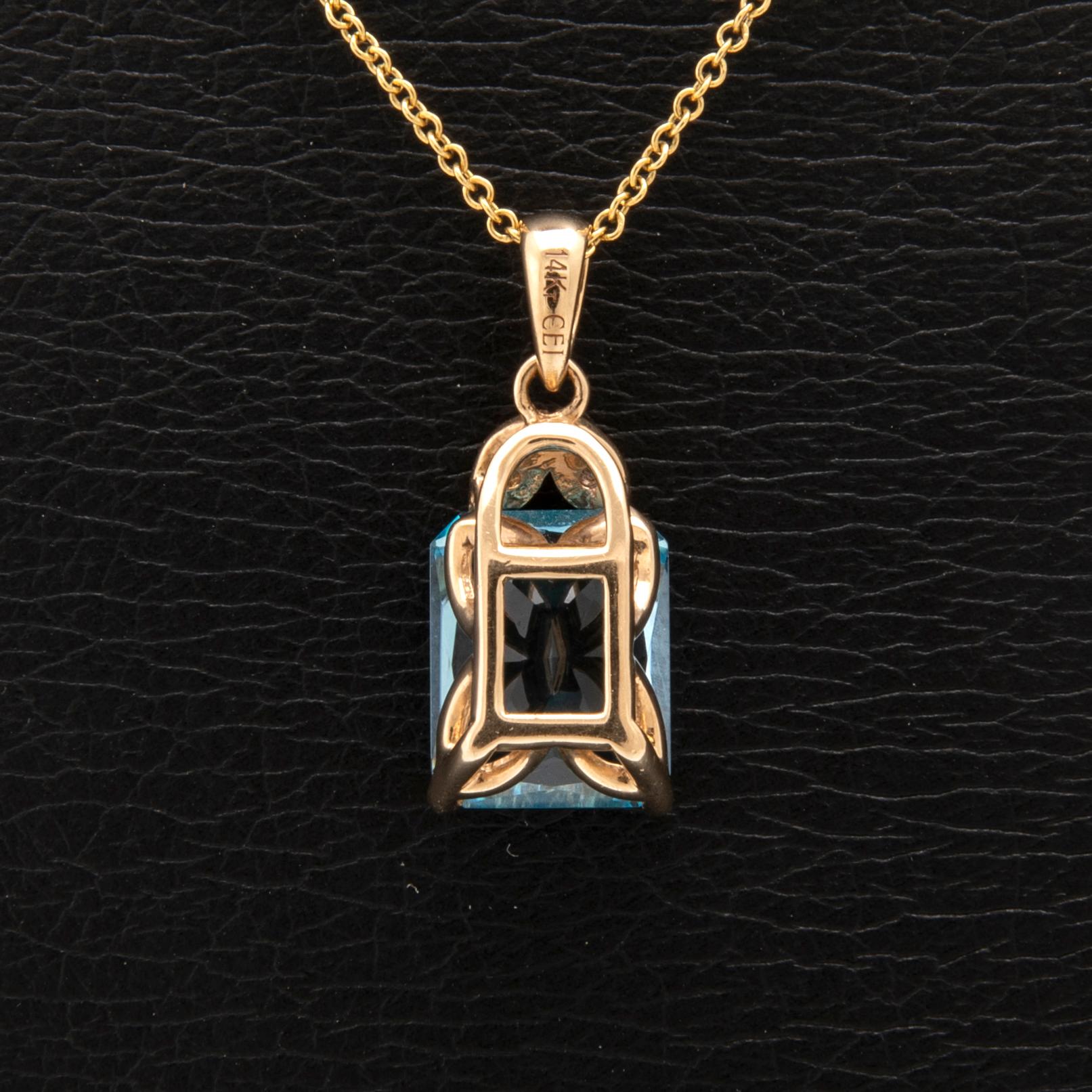 Halsband 14K guld med trappslipad blå topas och runda briljantslipade diamanter.