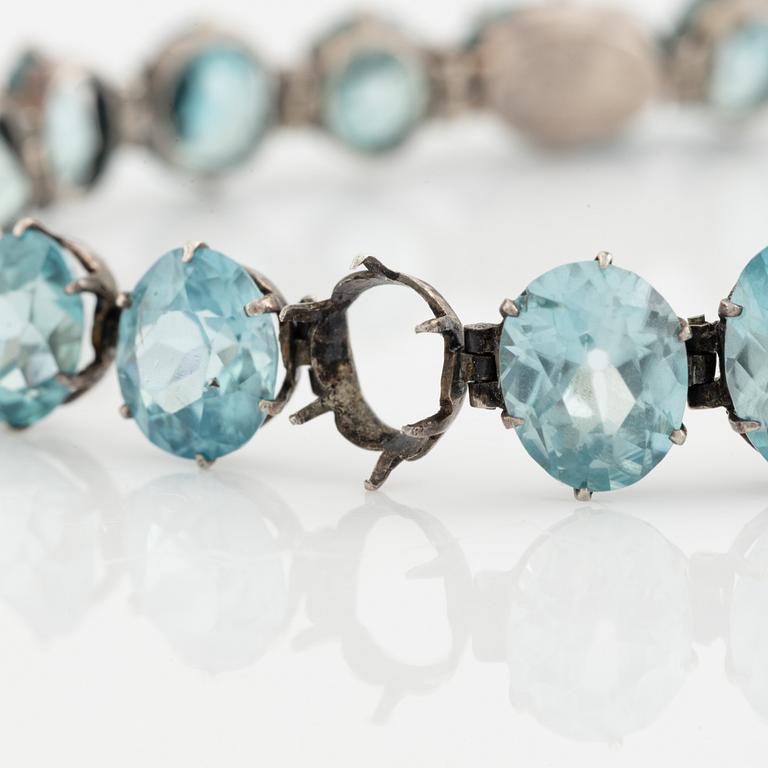 Silver and blue zircon bracelet.