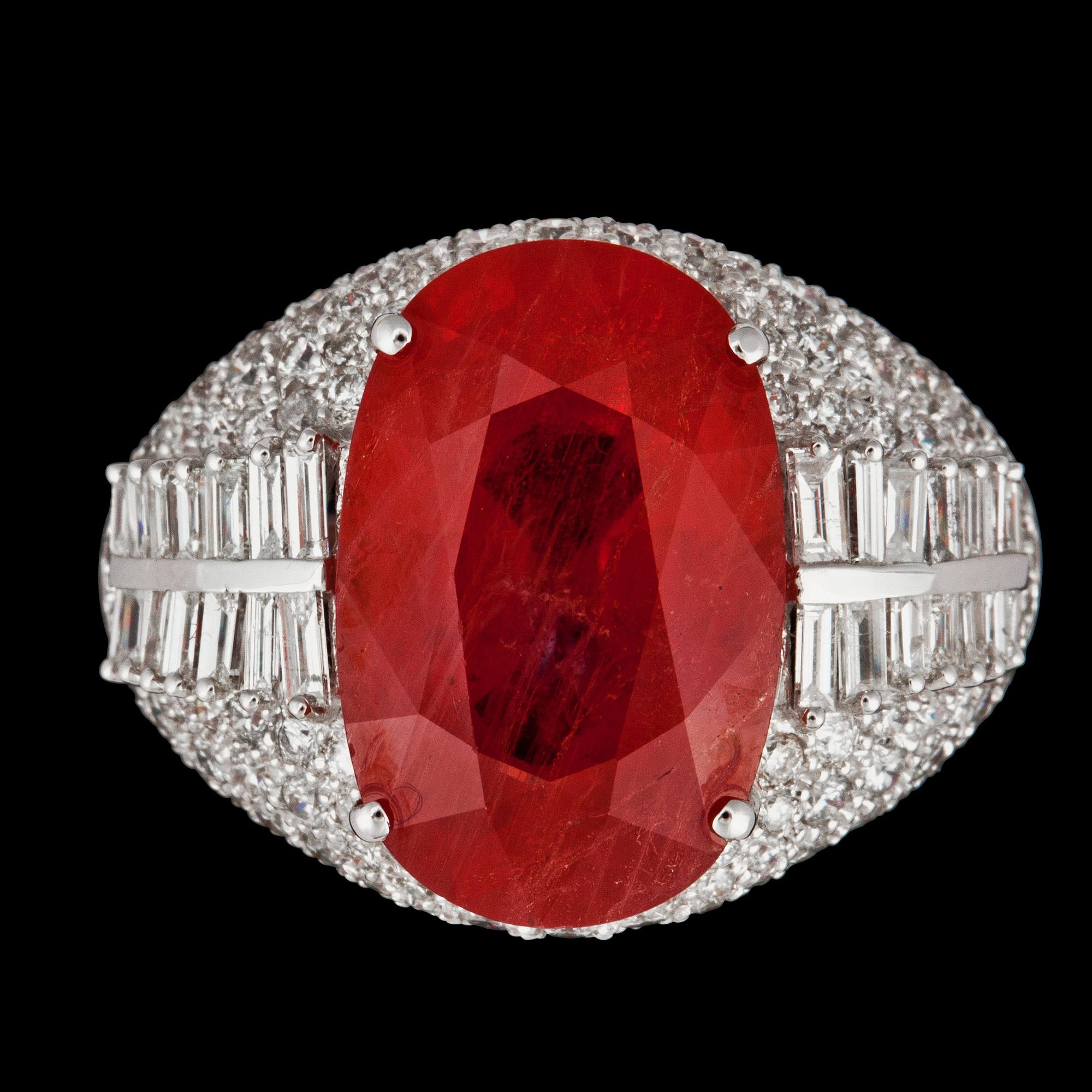 A orange sapphire, 12.61 cts, and diamonds, circa 2.50 cts, ring.