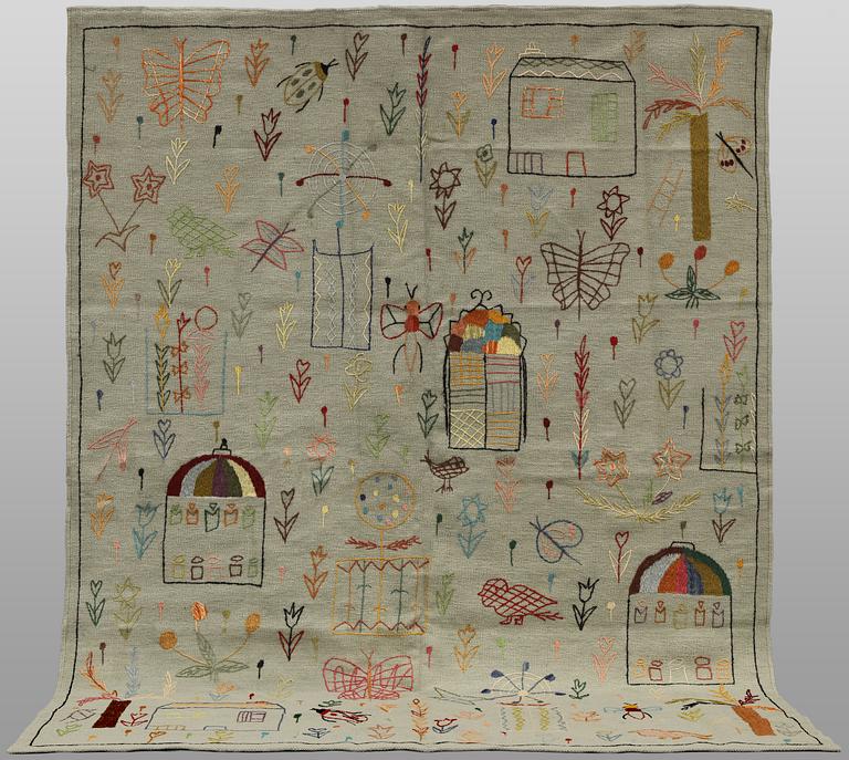 A hand-embroidered Kilim rug, approx. 241 x 183 cm.