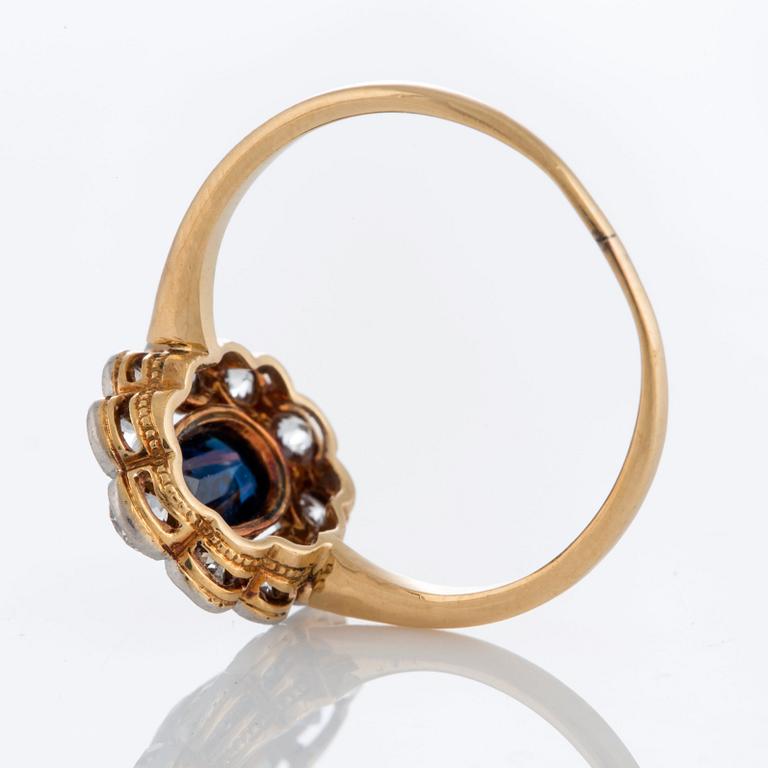 A sapphire ring in platinum and 18K gold set with old-cut diamonds.