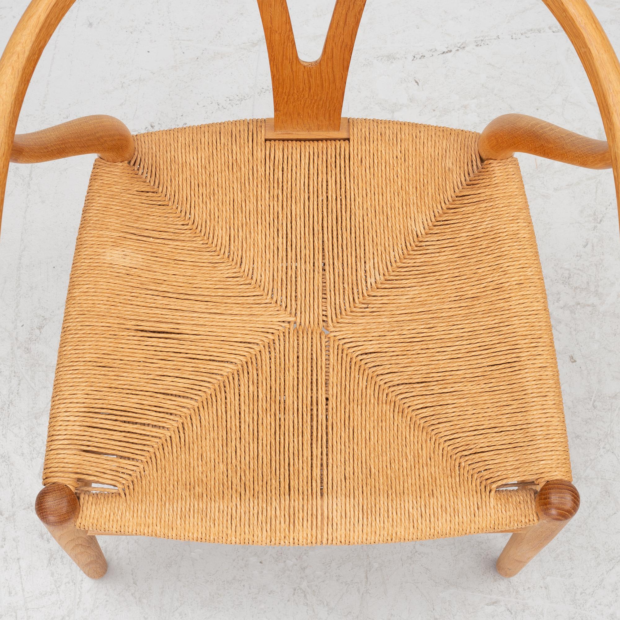 Hans J. Wegner, four model CH-24/ 'Wishbone' chairs, Carl Hansen, Odense, Denmark, second half of the 20th century.