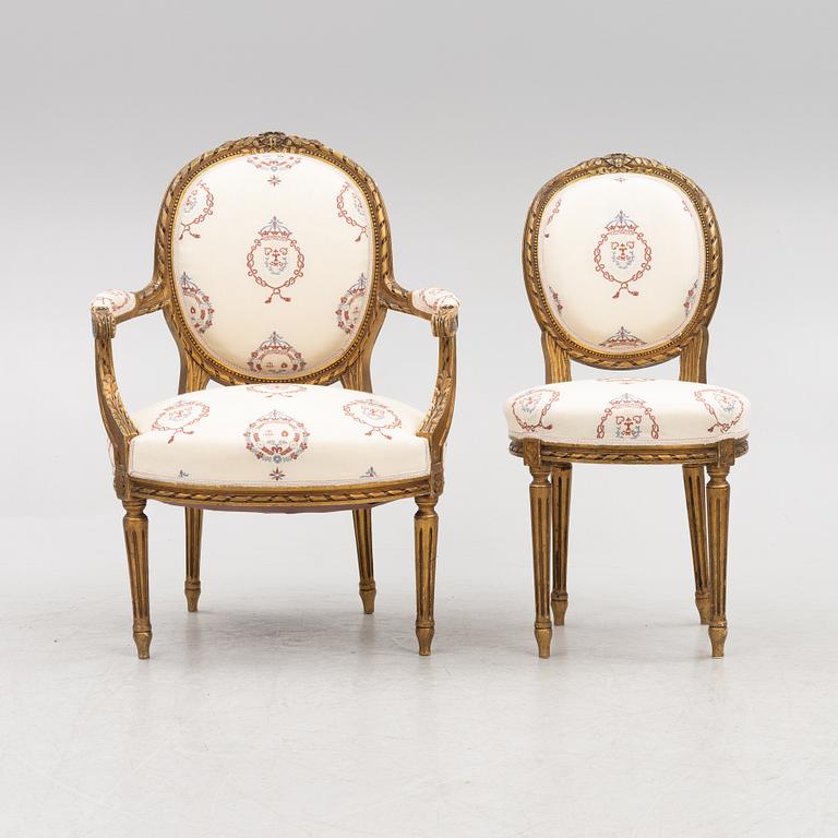 A Gustavian style sofa with two armchairs and two chairs, 20th century.