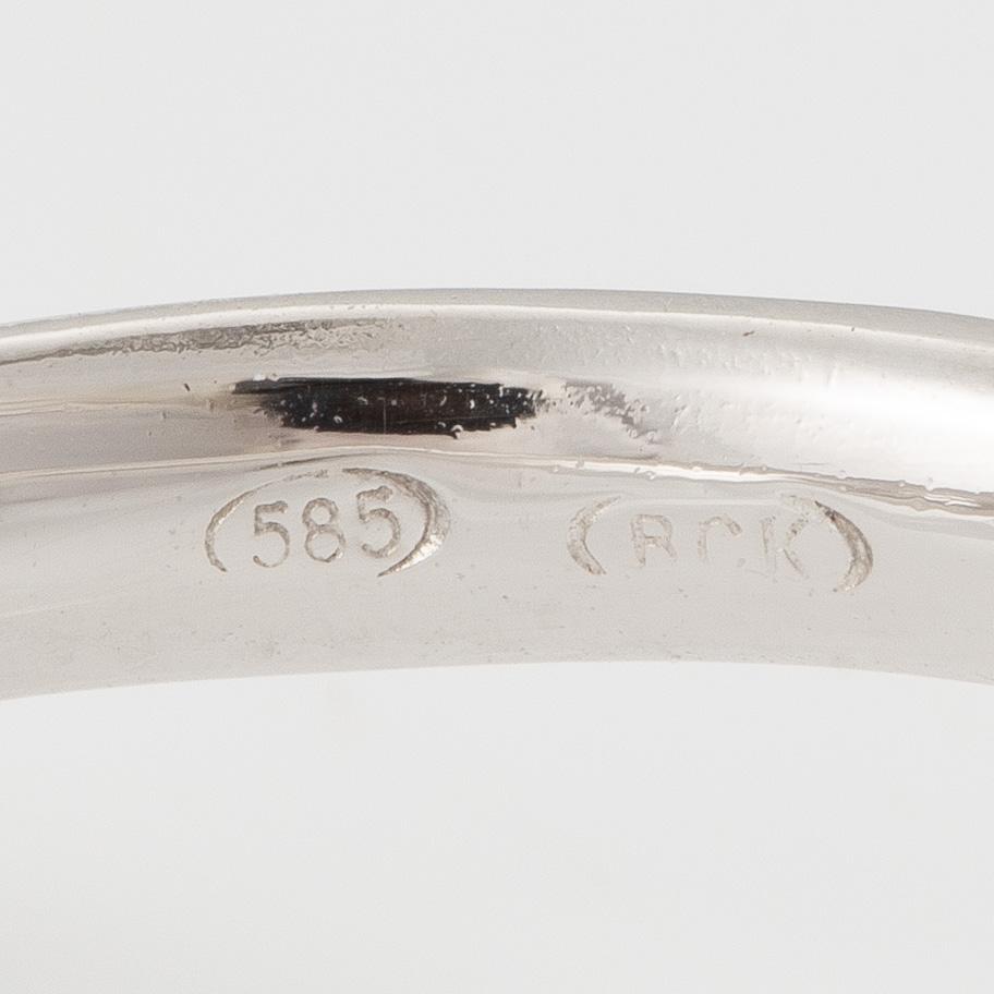 Ring, cocktail ring, 14K white gold with emerald-cut aquamarine and brilliant-cut diamonds.