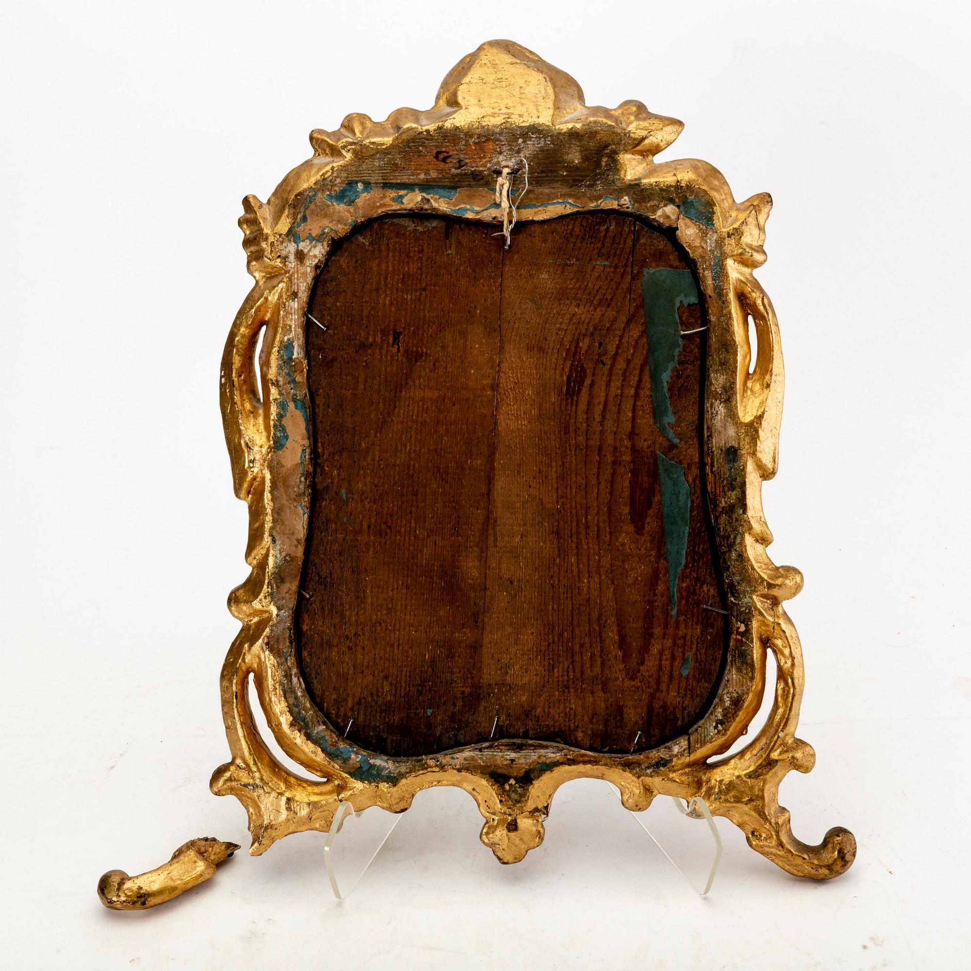 A mid 18th century gilded rococo mirror.