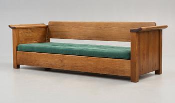 An Axel Einar Hjorth stained pine sofa 'Sandhamn', by Nordiska Kompaniet ca 1929.