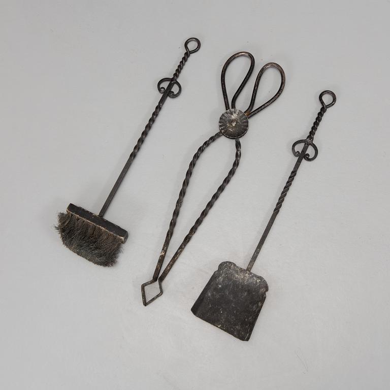 A set of wrought iron fire utensils.