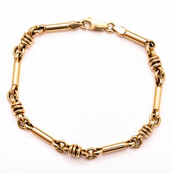 A 14K gold bracelet.
