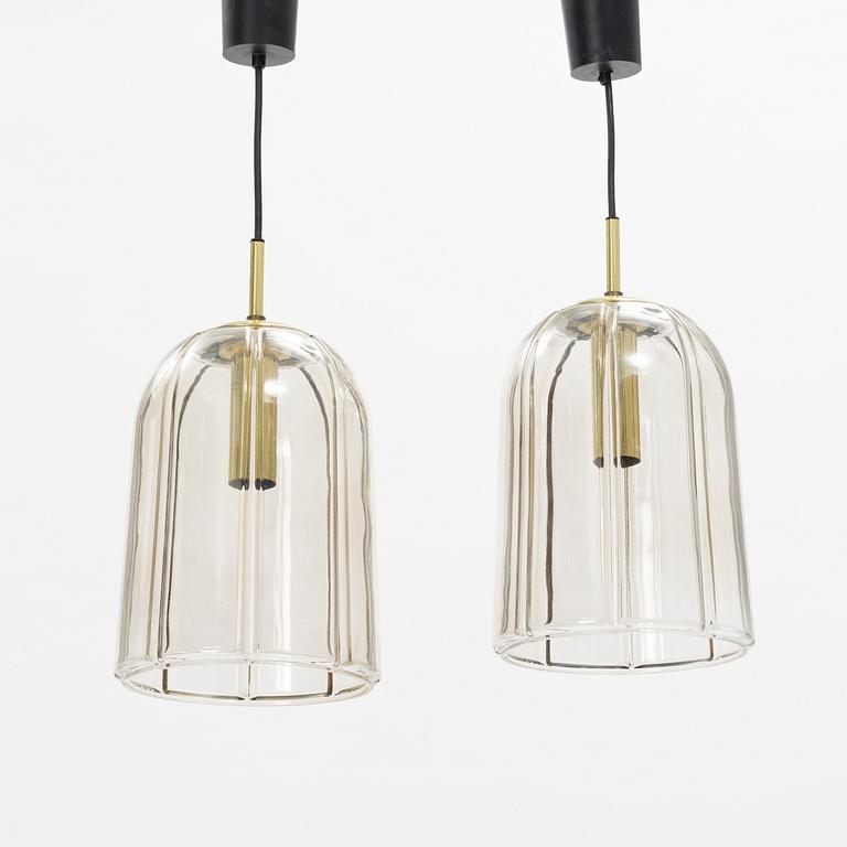 A pair of glass and brass ceiling lights, Glashütte Limburg, Germany.