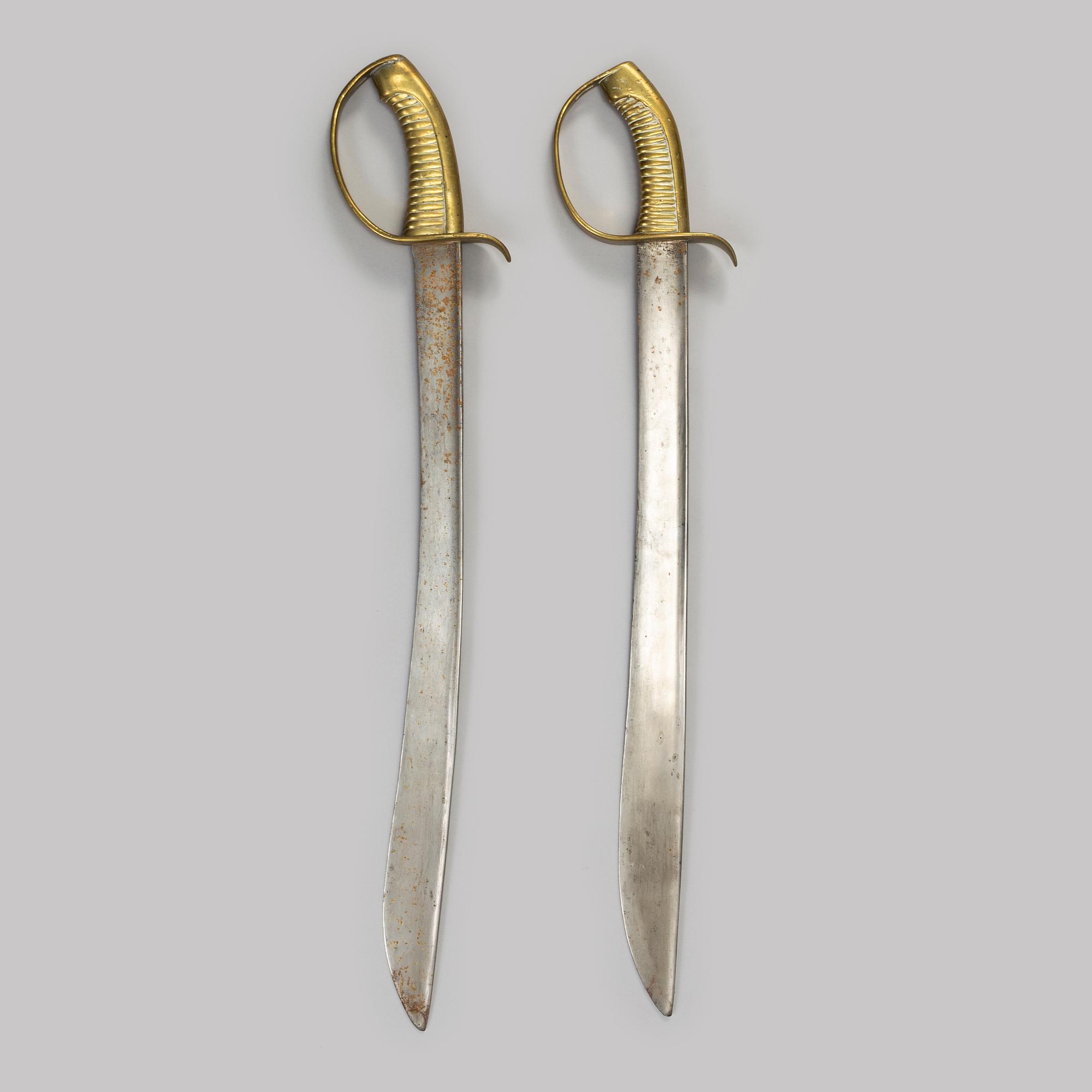 Two Swedish cutlasses 1846 pattern.
