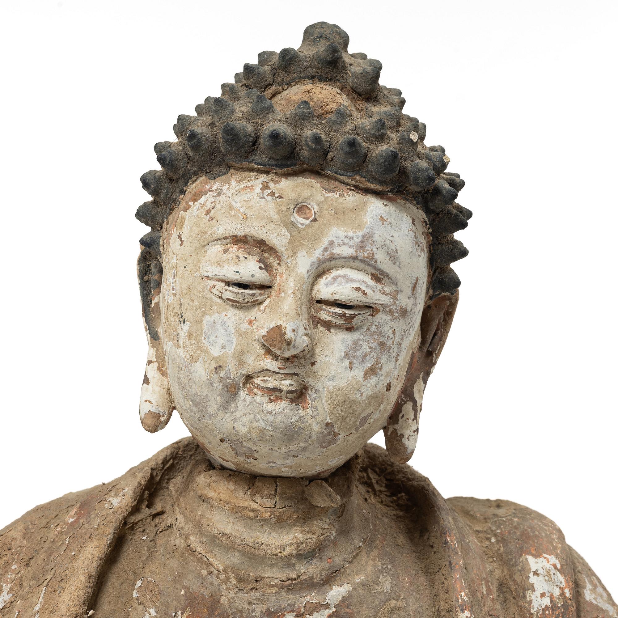 A Southeast Asian figure of a Buddha, 20th century.