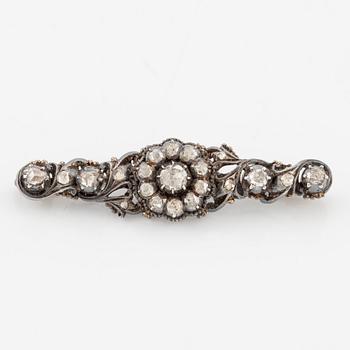 Brooch in silver and 18K gold set with rose-cut diamonds.