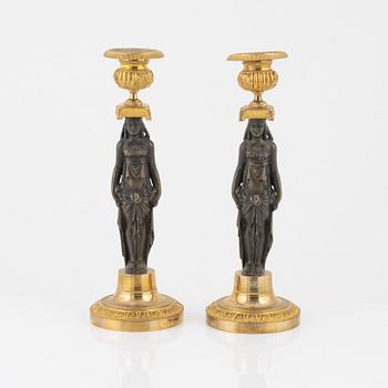 A pair of empire/style candlesticks.