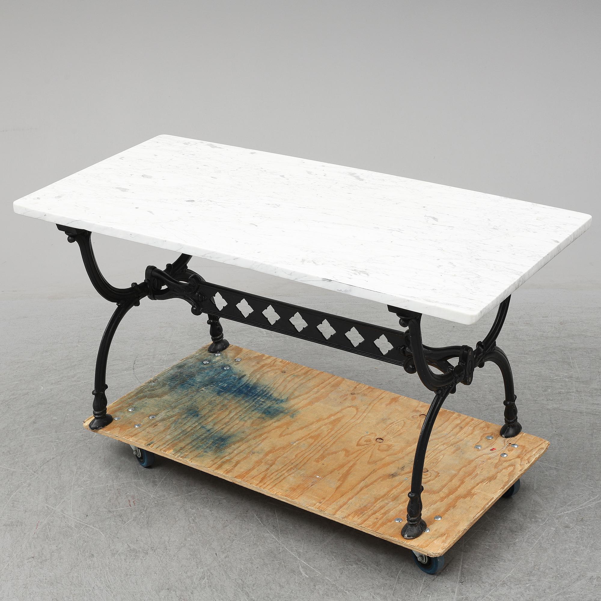 An end of the 20th Century aluminum and marble garden table.
