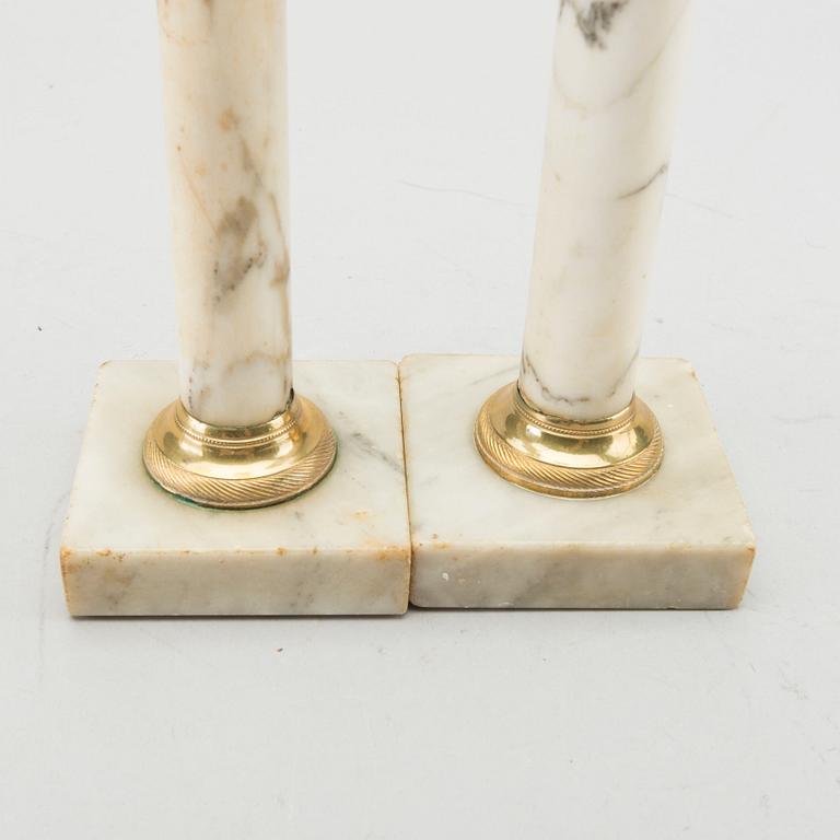 A pair of Late Gustavian marble candle sticks.