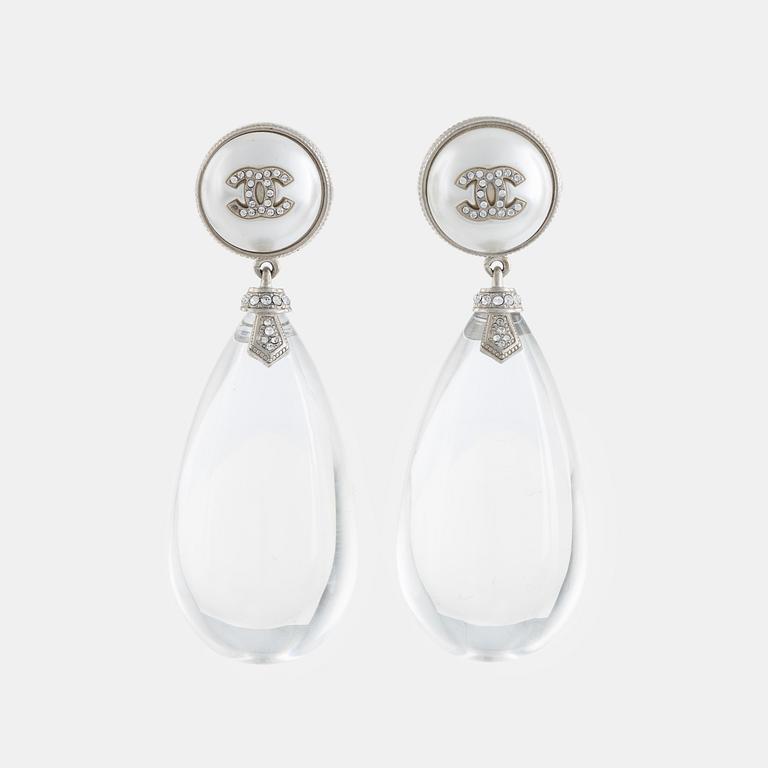 Chanel, a pair of clear resin, imitation pearl and strass earrings, 2018.