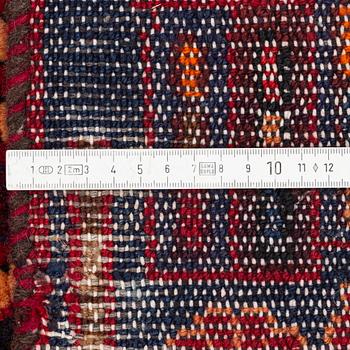 An oriental rug, ca 233 x 128 cm.