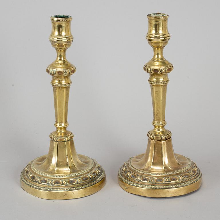 A pair of Louis Seize bronze candlesticks, late 18th century.