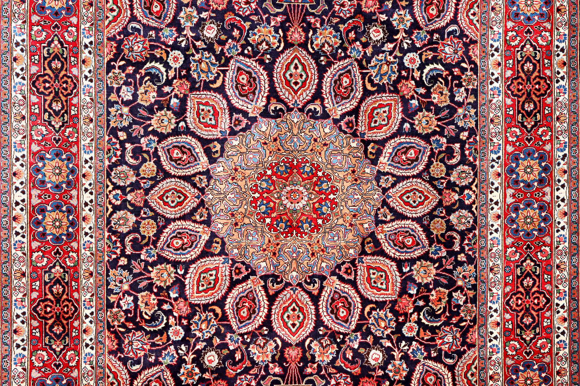 A Meshed carpet, c. 352 x 253 cm.