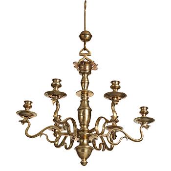 79. A six-light 18/19th century brass chandelier.