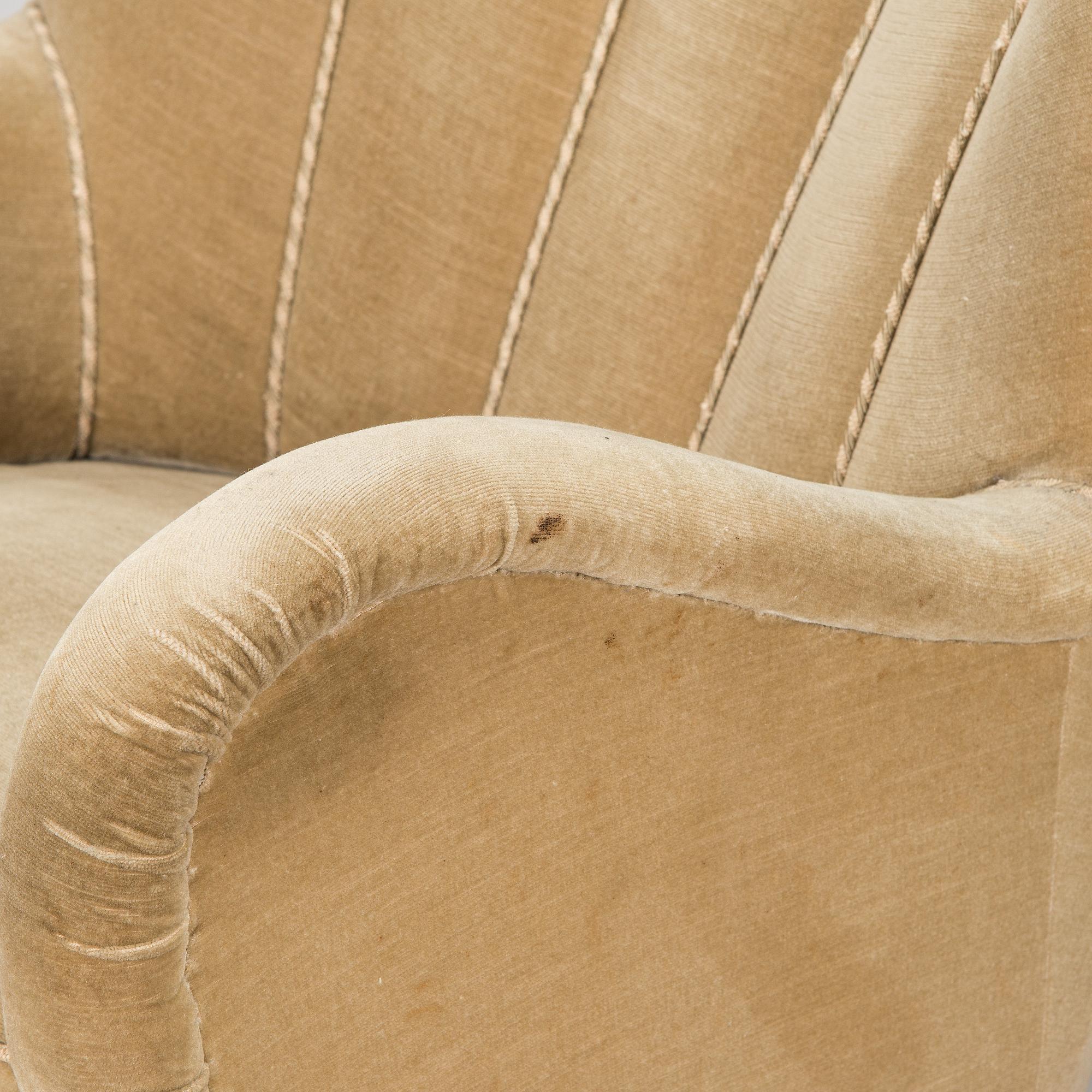 A pair of mid-20th century armchairs.