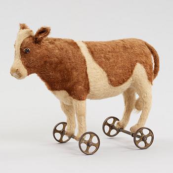 a STEIFF cow on wheels, Germany ca 1910.