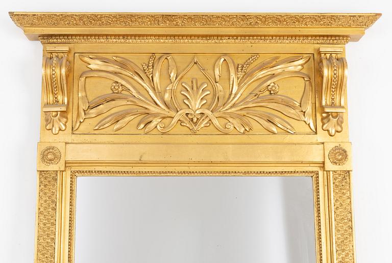 An Empire mirror, first half of the 19th century.