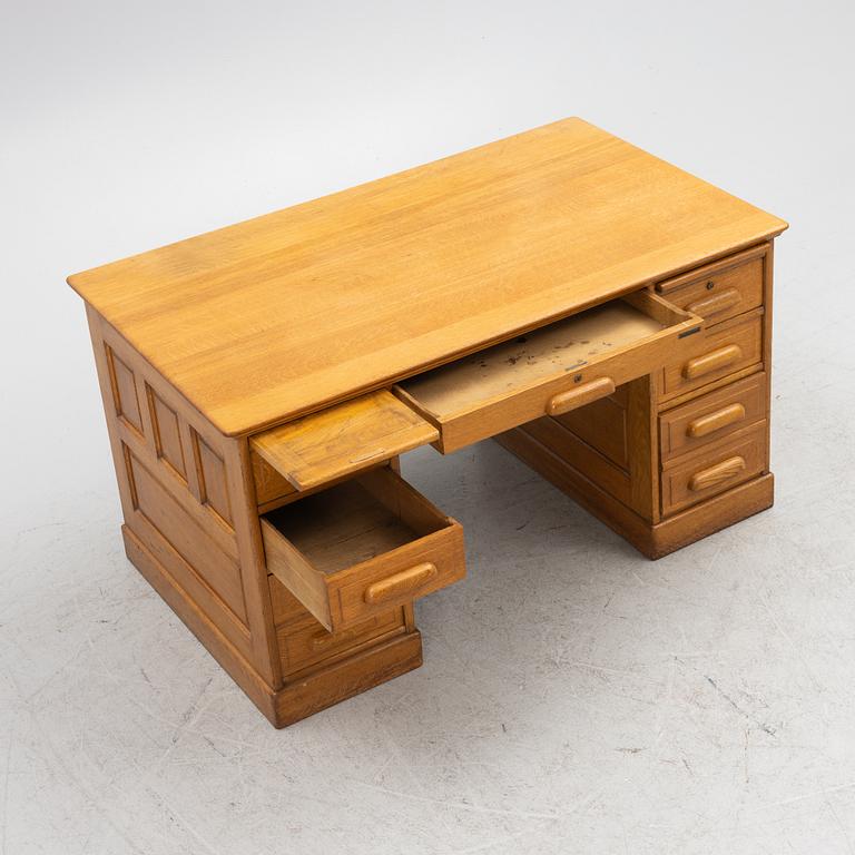 An oak writngdesk with a chair from Åtvidabergs, first part of the 20th century.