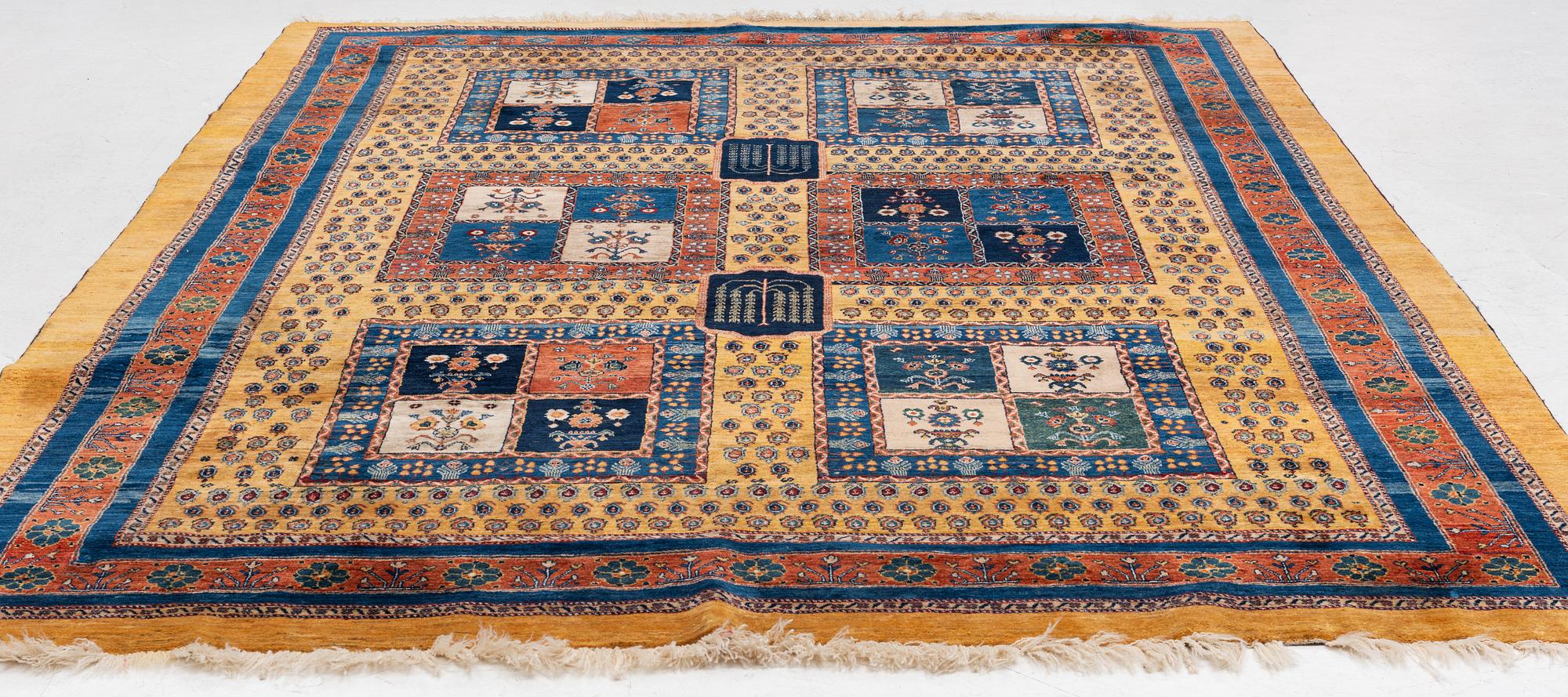 An oriental 'garden' carpet of Safavid design probably from the Shiraz area, Iran, c 343 x 254 cm.