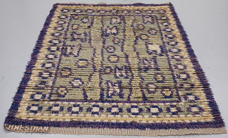 A CARPET, knotted pile, ca 225 x 138 cm, signed GH.WESTMAN, attributed to Hans (Gustaf) Westman.