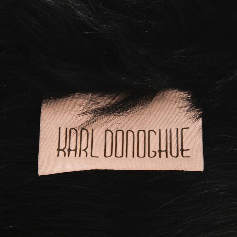 KARL DONOGHUE, a black fur collar.