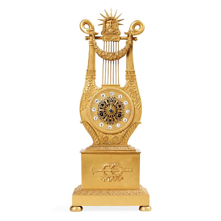 A French Empire early 19th century gilt bronze mantel clock.