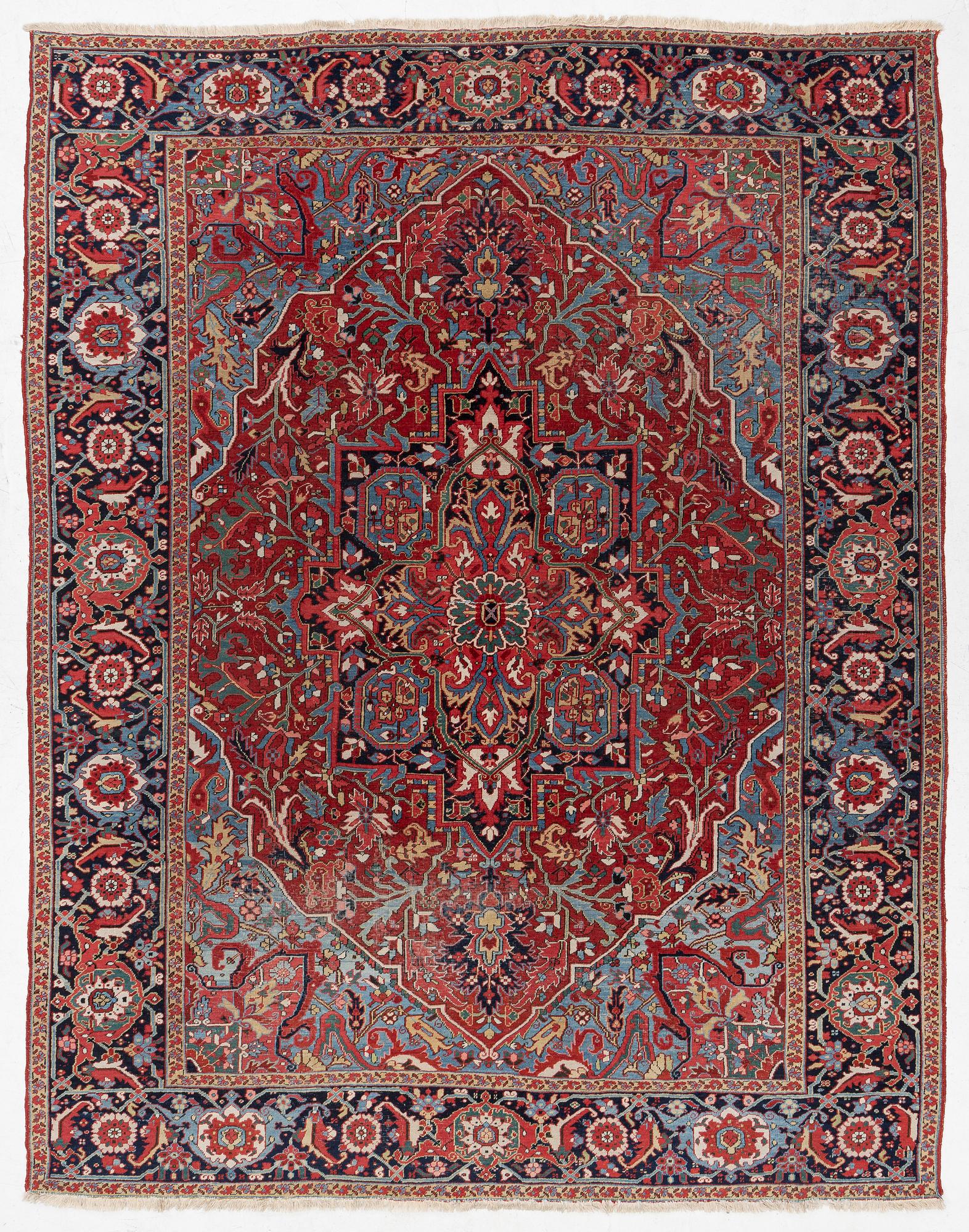 An Antique Heriz carpet, North west persia, c. 380 x 310 cm.