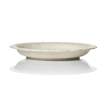 Wilhelm Kåge, 15 pieces of "Carrara" and "Gold Carrara" stoneware dishes, Gustavsberg, Sweden, 1930s/40s.