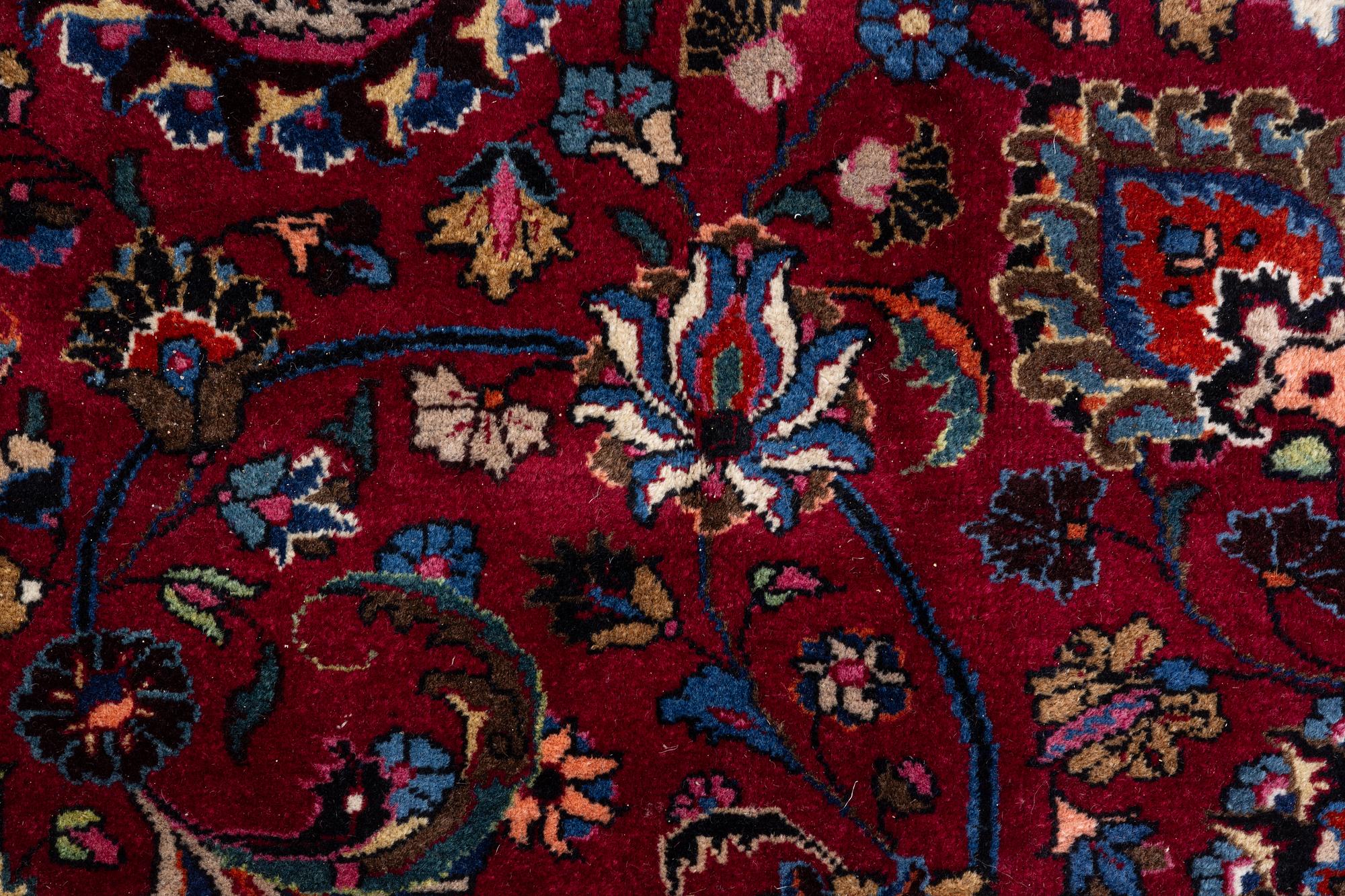 A Meshed carpet, c. 393 x 305 cm.